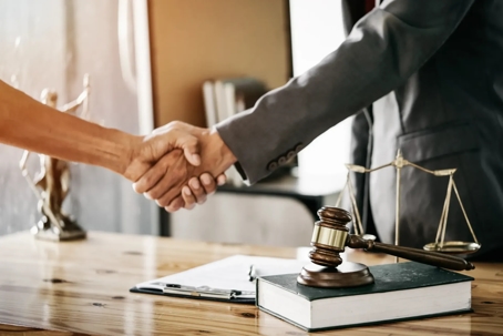 Lawyer and Client shaking hands